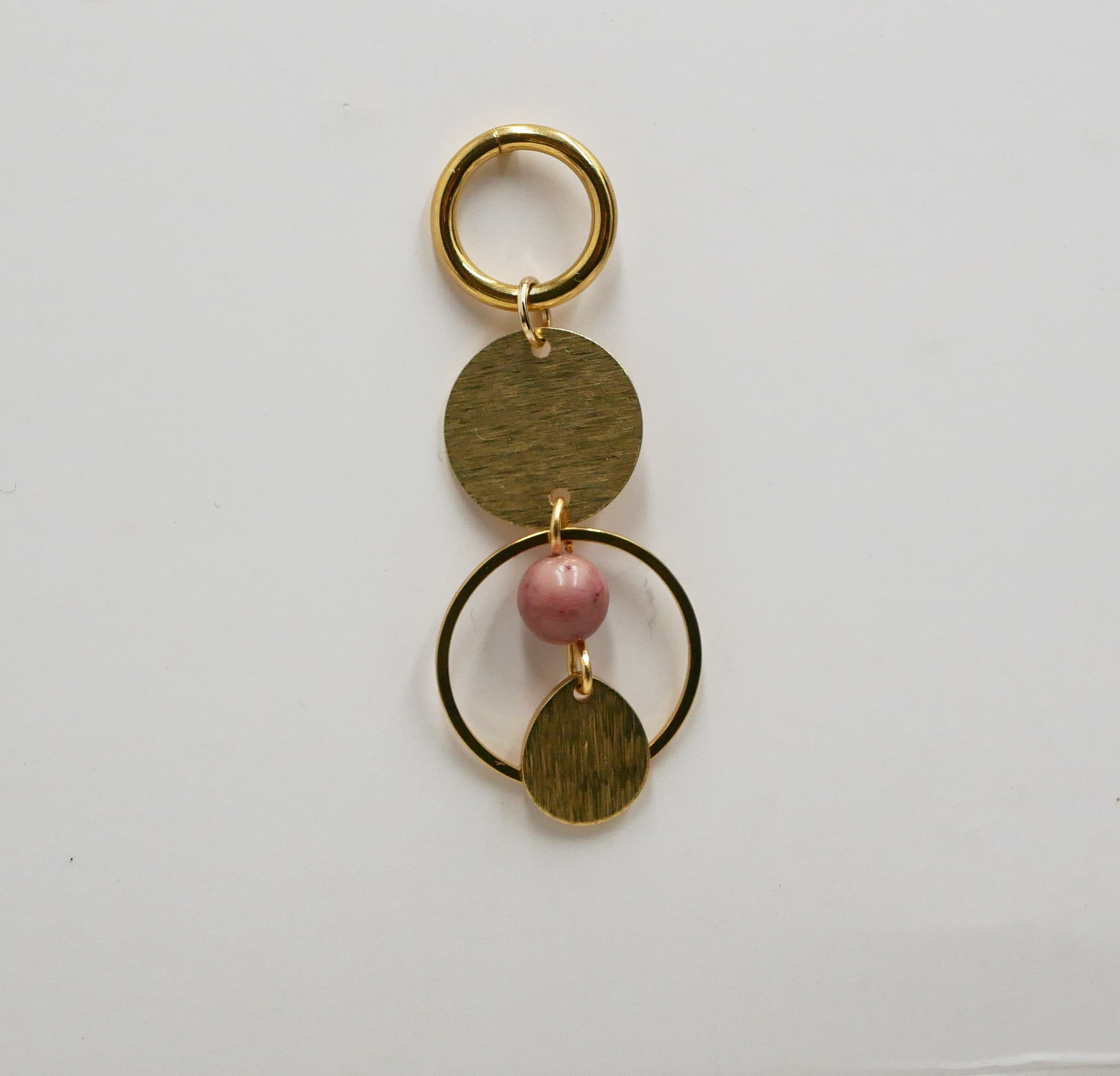 Solo earring with gold hoops and rounds and pink Rhodonite pearl