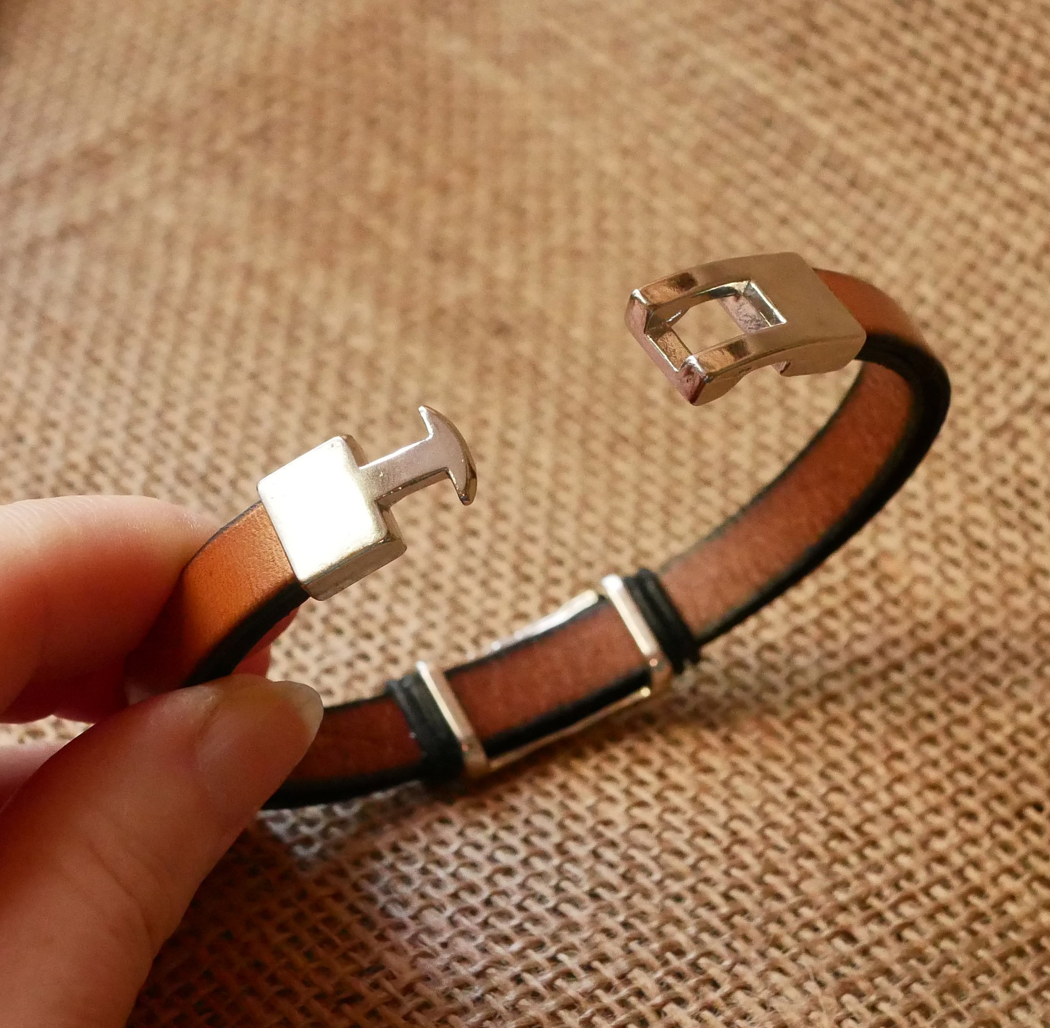 Camel leather strap with braided metal decoration and T-shaped clasp