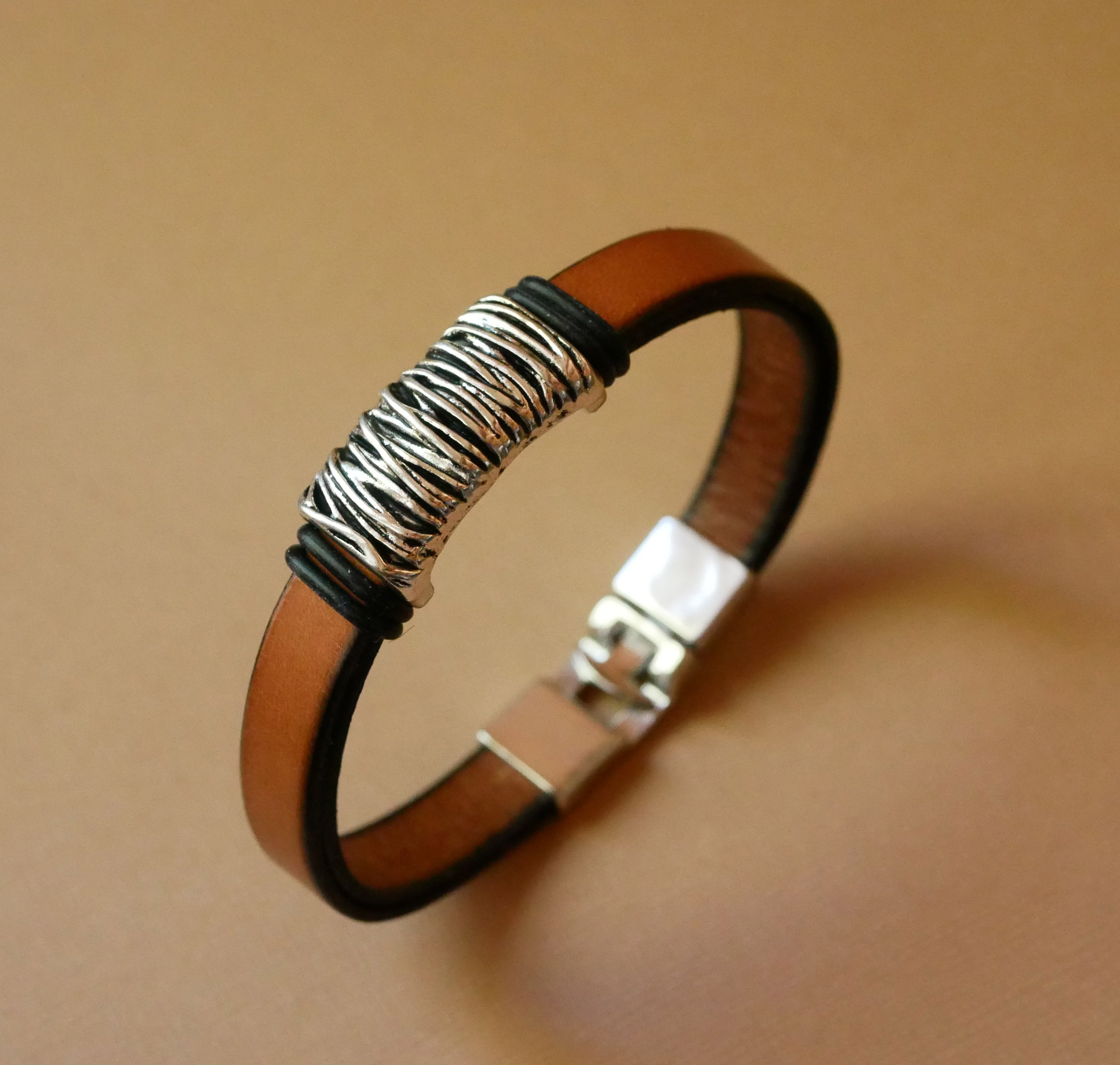 Camel leather strap with braided metal decoration and T-shaped clasp