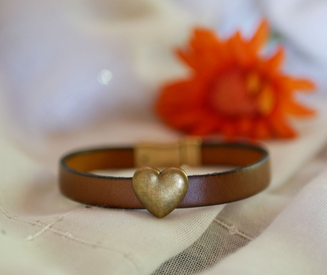 Customizable leather strap with aged bronze heart 