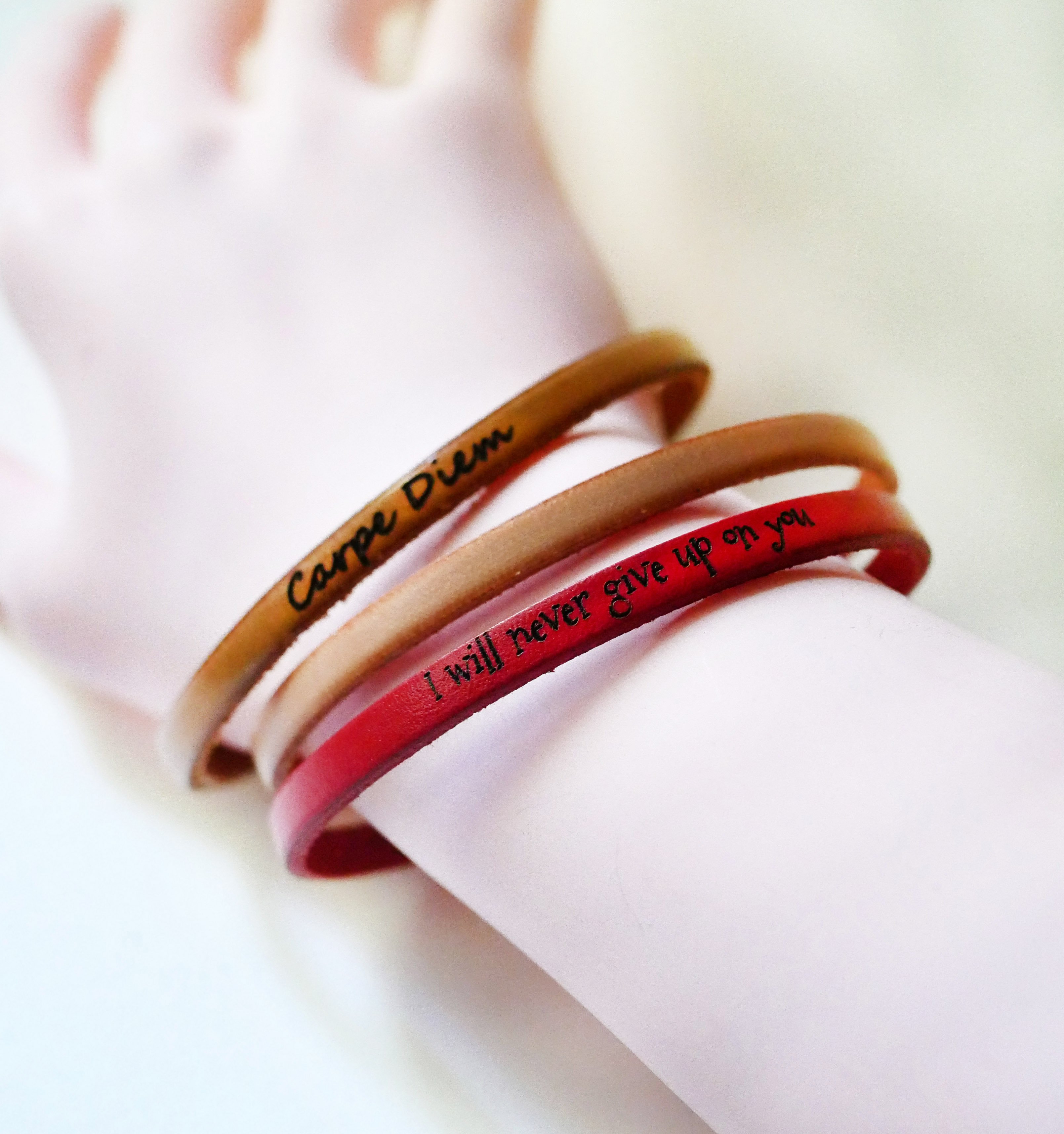 Fine leather strap with adjustable gold clasp, customizable by engraving 