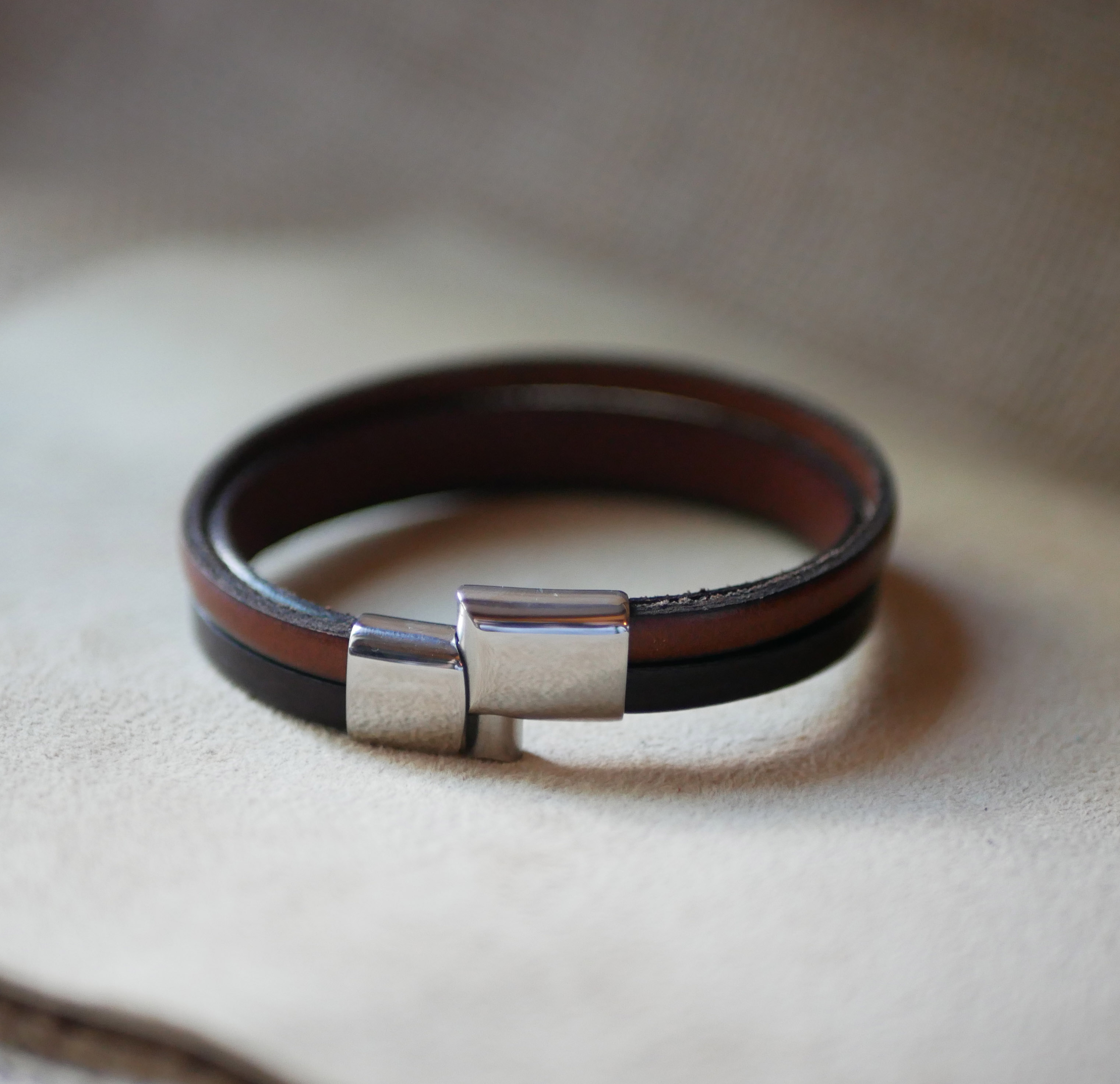 Two-tone men's leather bracelet with hidden engraved message