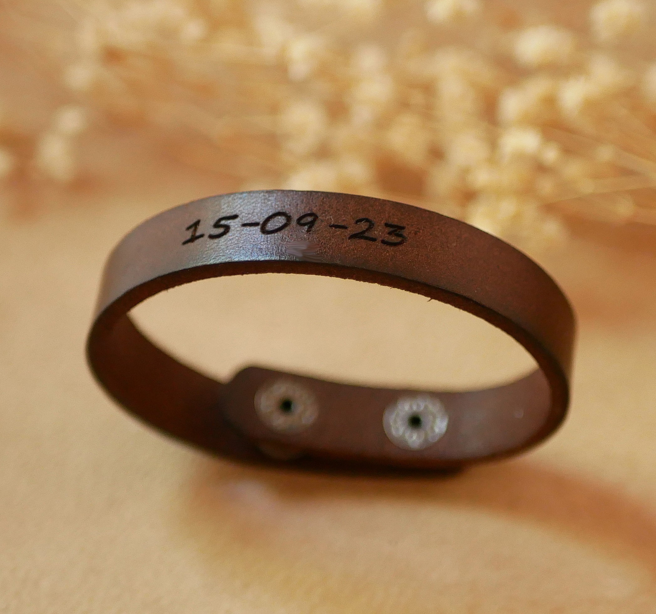 Custom engraved dark brown leather strap Mixed with snap fasteners