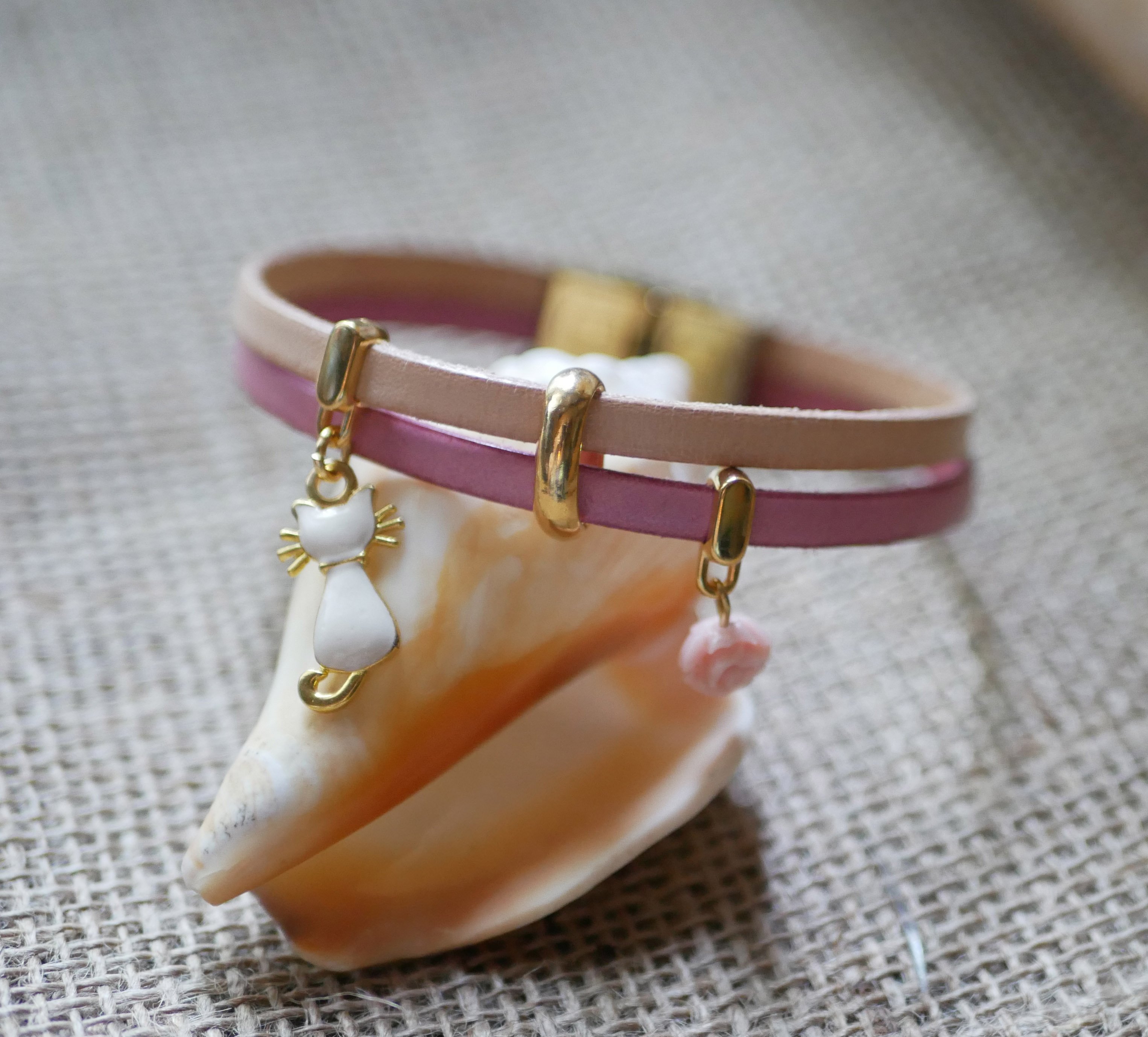 Leather duo bracelet with gold cat and pink charms 