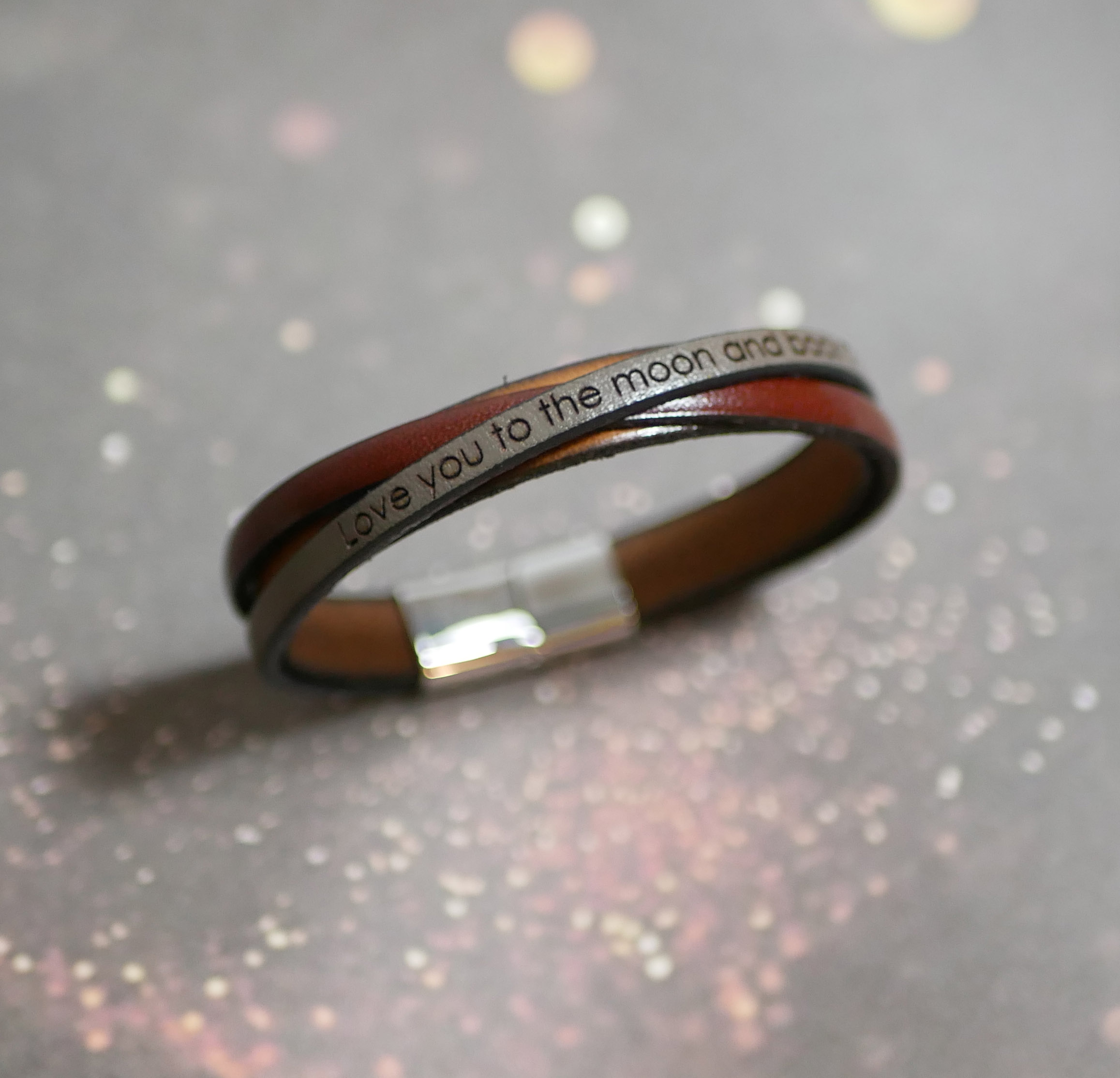 Two-tone crossed leather cuff bracelet with engraved message for men