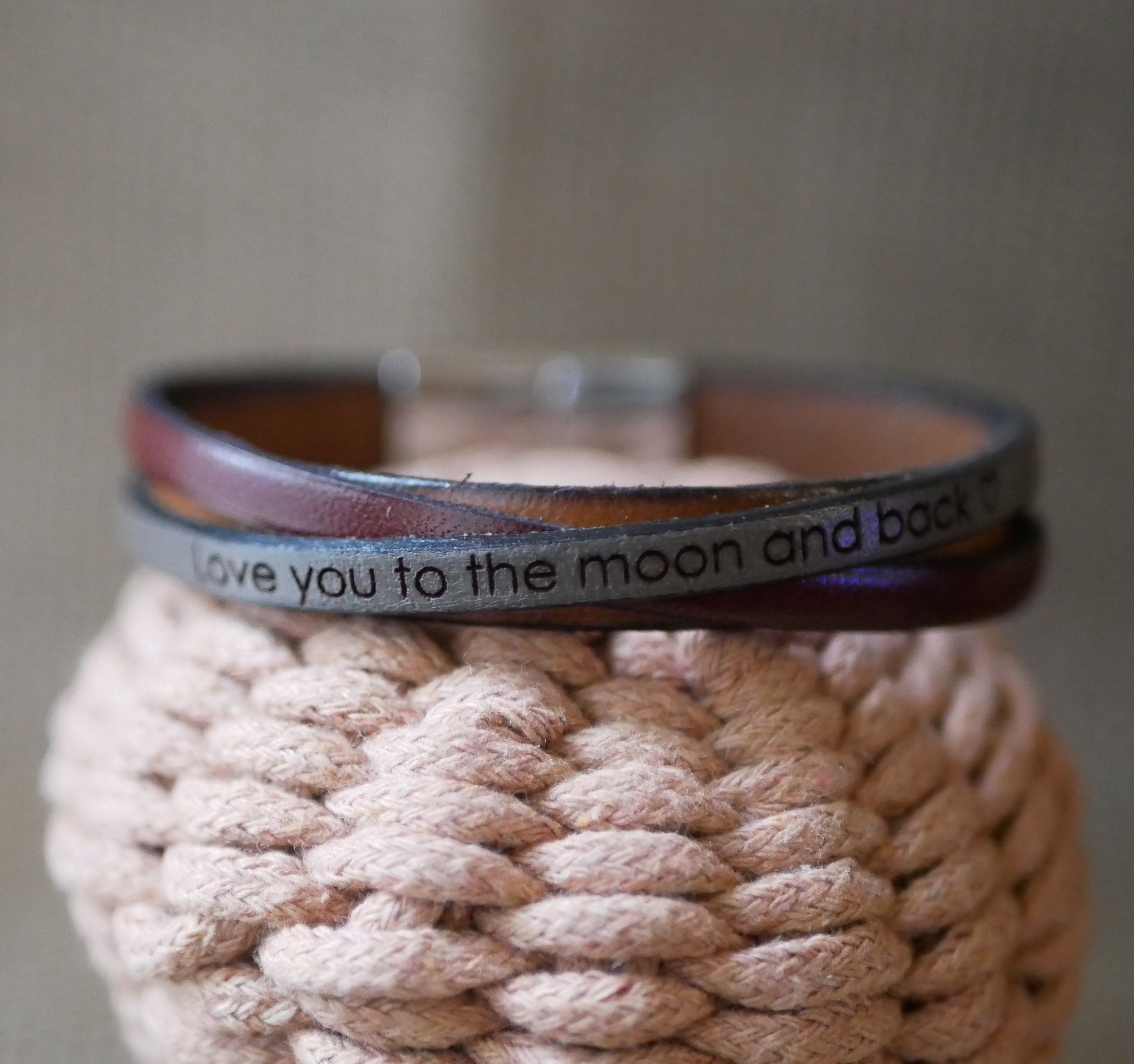 Two-tone crossed leather cuff bracelet with engraved message for men