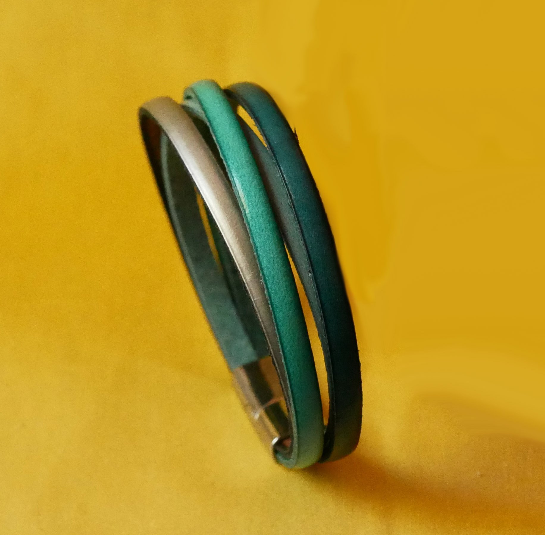 Cuff bracelet with 4 turquoise leathers