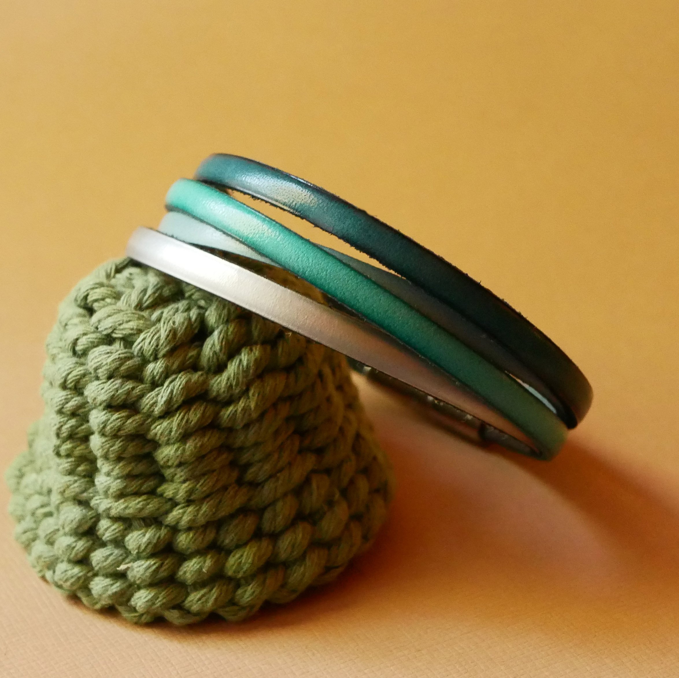 Cuff bracelet with 4 turquoise leathers