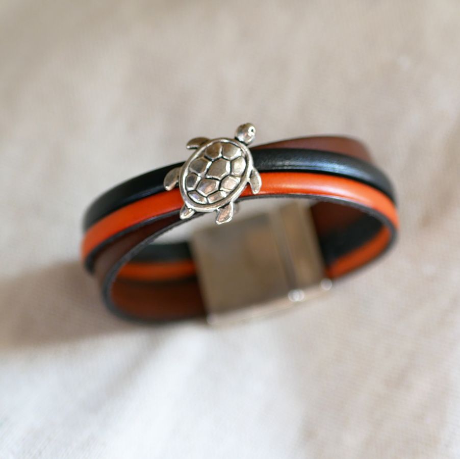 Multi-leather cuff bracelet with turtle design and large magnetic clasp