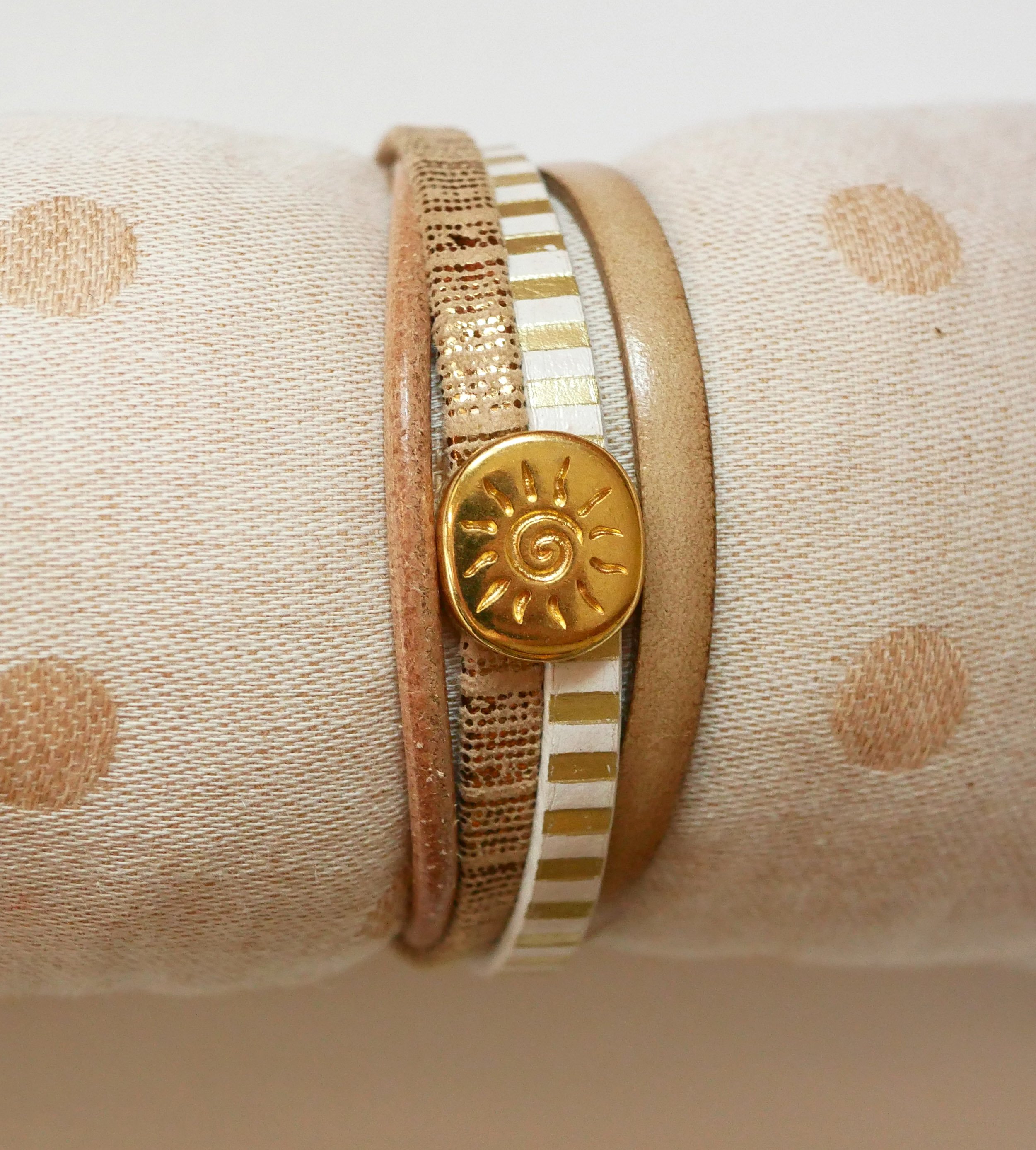 Multi-link leather cuff bracelet with gold sunburst loop