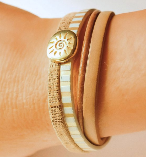 Multi-link leather cuff bracelet with gold sunburst loop