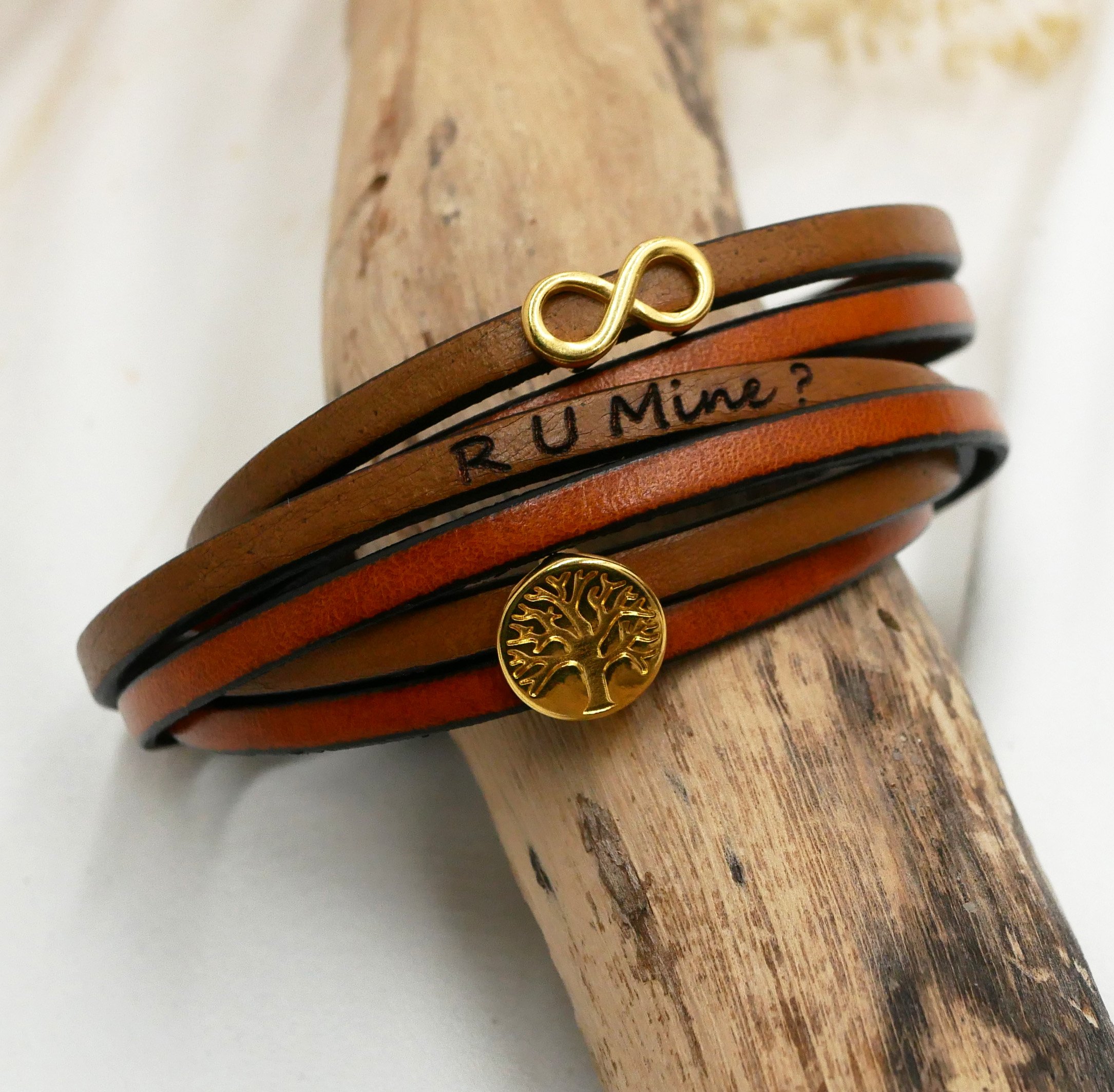 Multi-turn infinity symbol leather bracelet with gold tree of life cabochon to personalize  