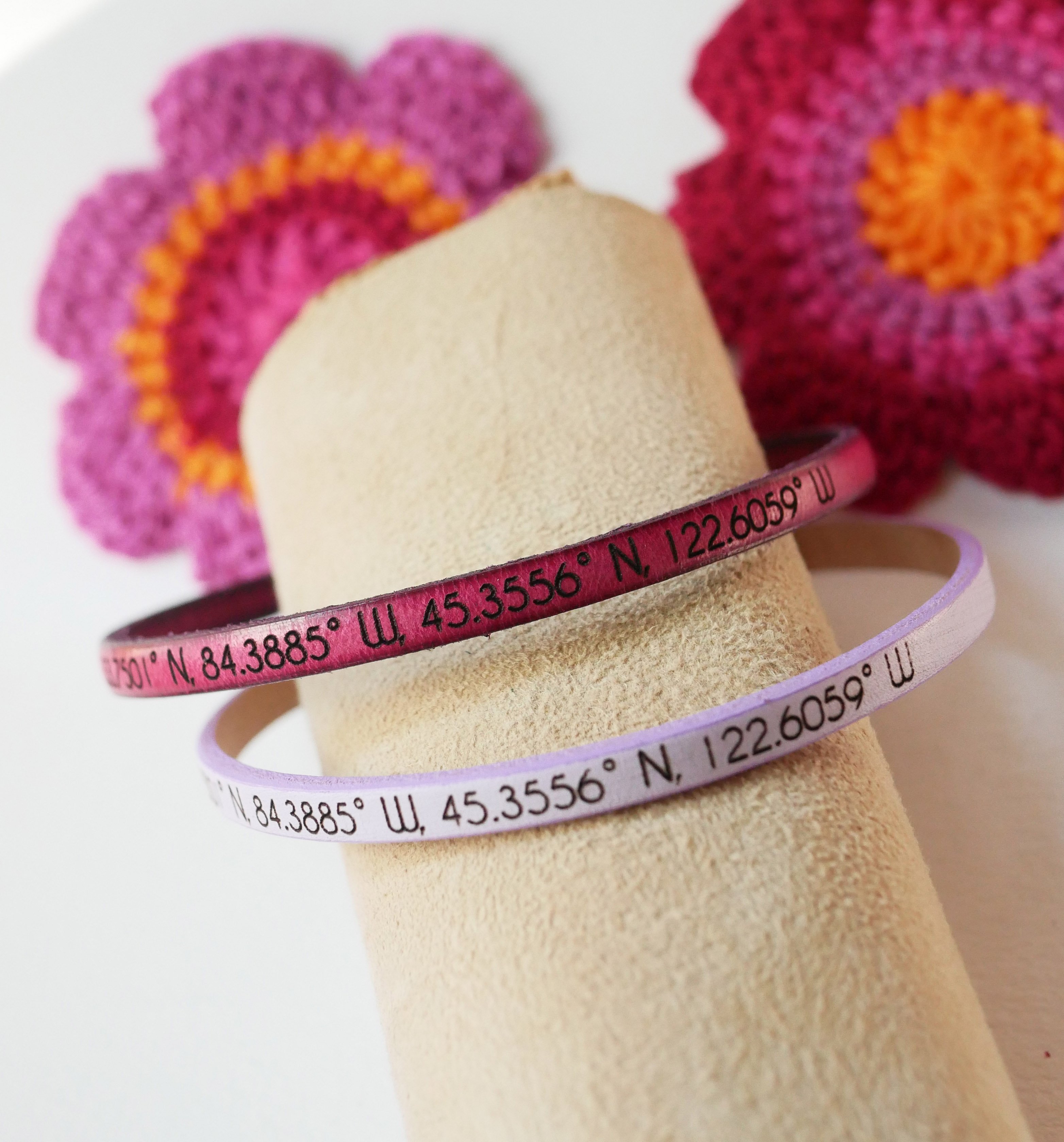 Gift bracelets for couples in leather, both personalized with the same engraving 