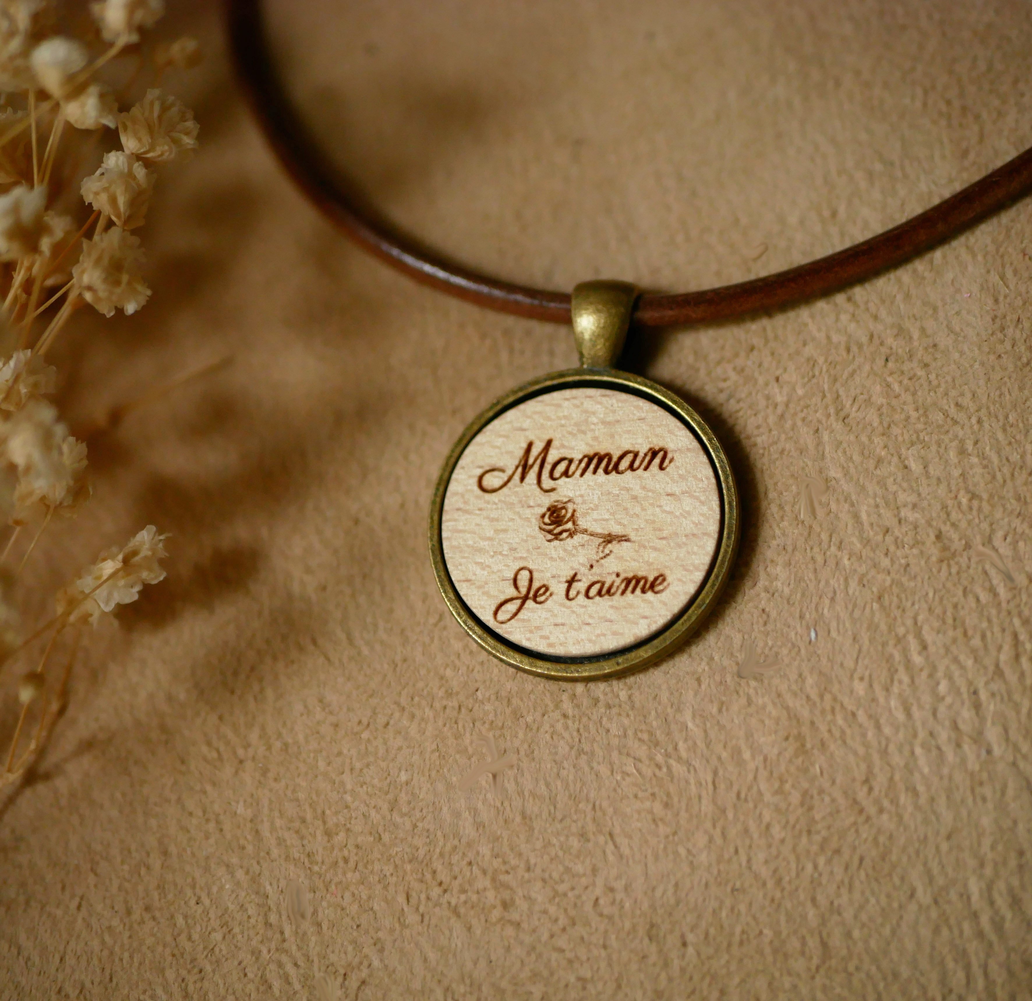 Leather necklace with engraved wood cabochon pendant set in antique brass to personalize