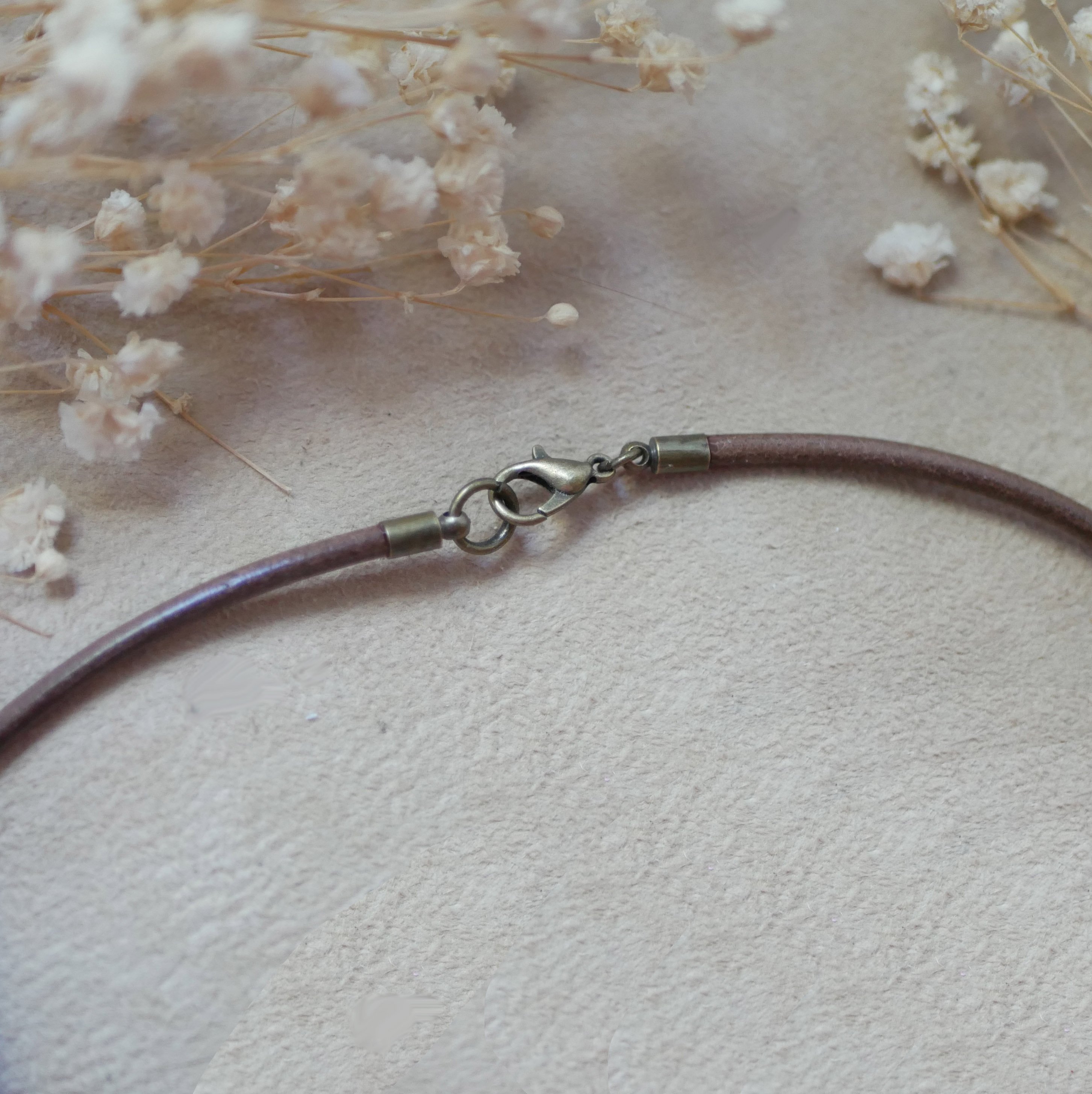 Leather necklace with engraved wood cabochon pendant set in antique brass to personalize