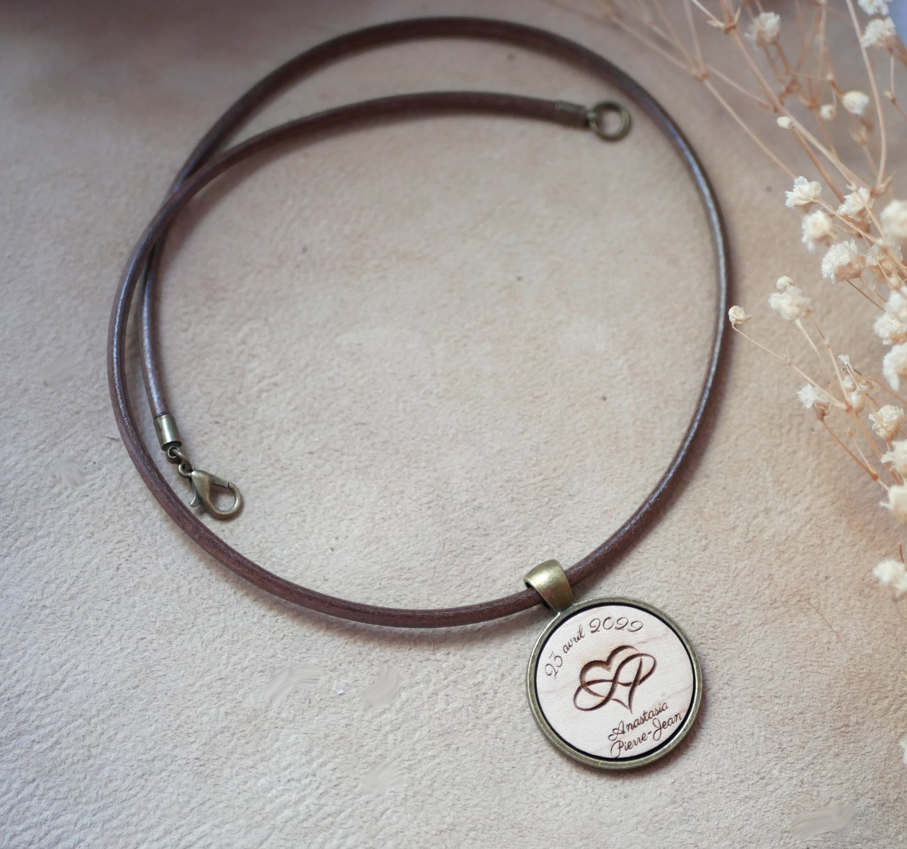 Leather necklace with engraved wood cabochon pendant set in antique brass to personalize