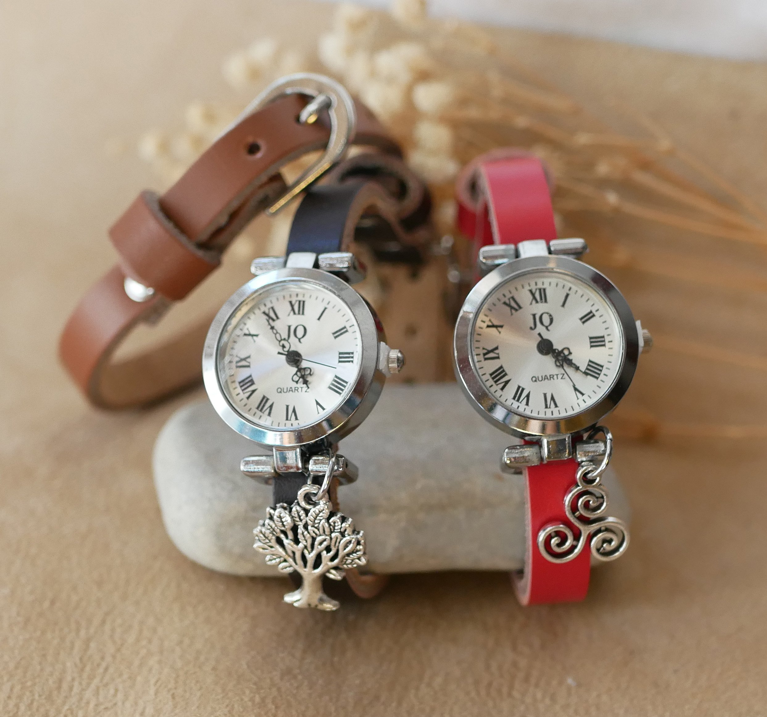 Silver watch with leather strap and silver buckle