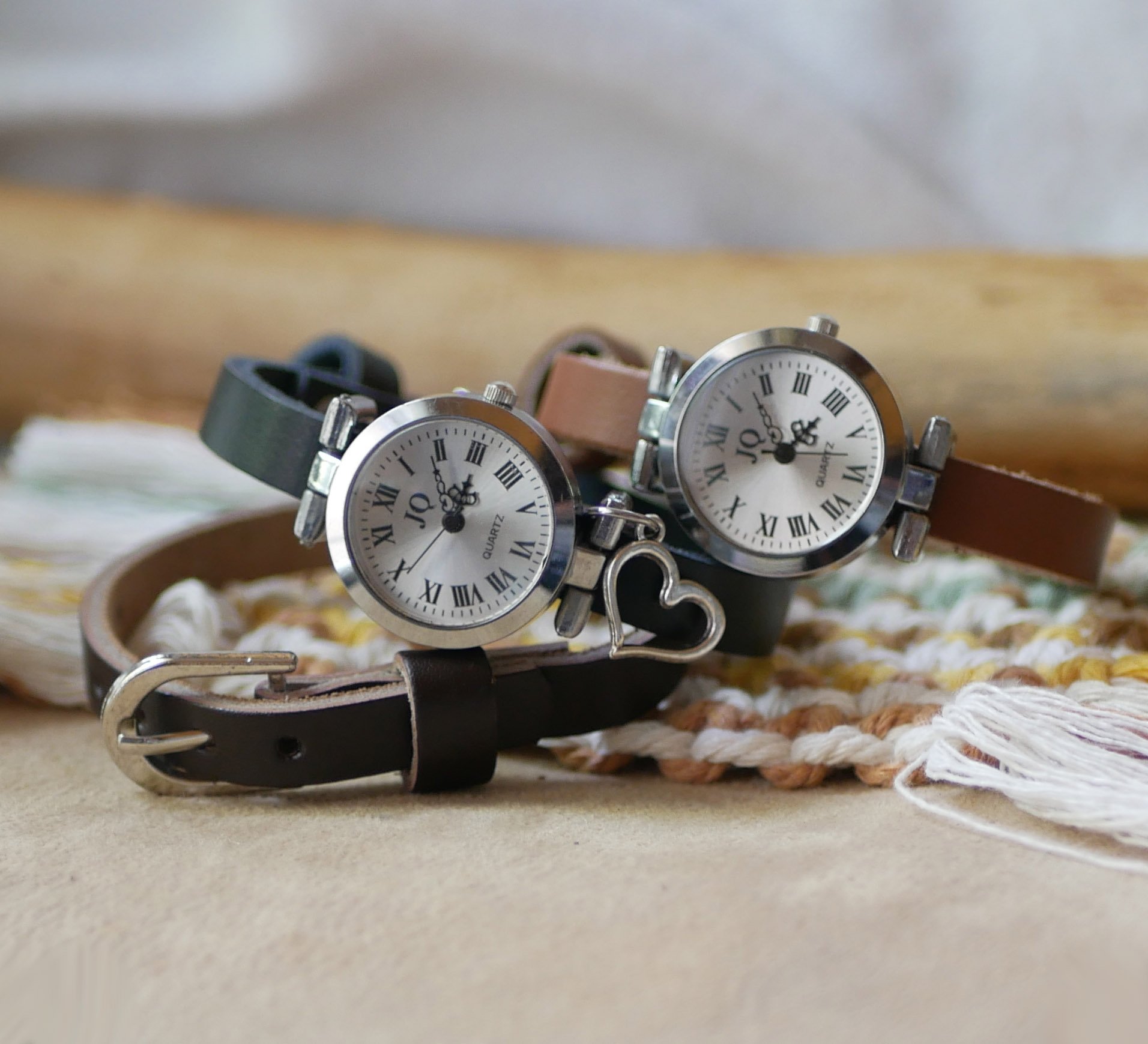 Silver watch with leather strap and silver buckle