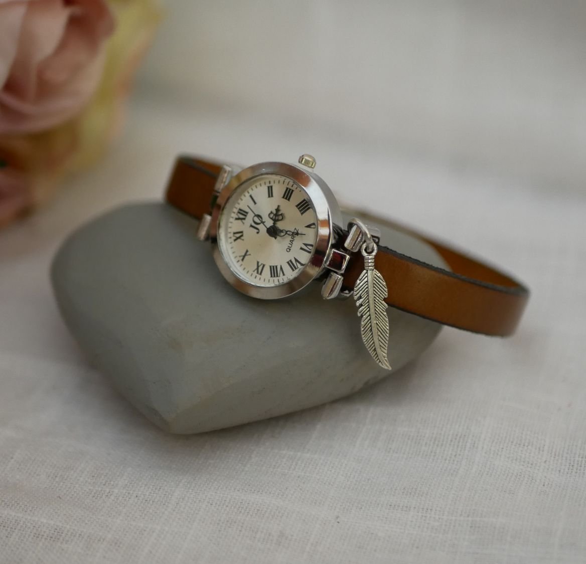 Silver watch with charm and leather strap with adjustable clasp