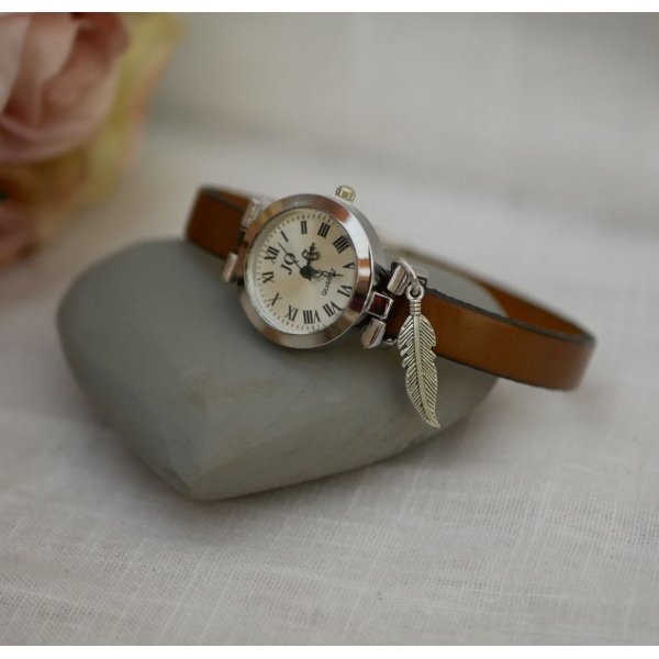 Silver watch with charm and leather strap with adjustable clasp