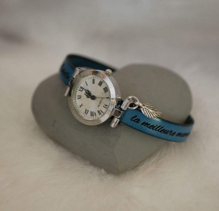 Silver watch with charm and leather strap with adjustable clasp