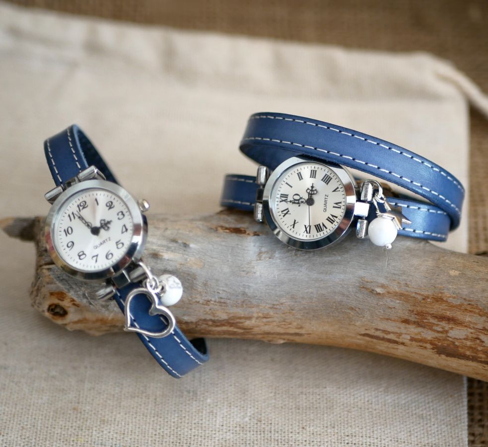 Watch with blue leather strap and white stitching