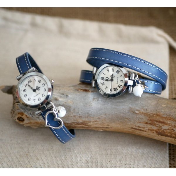 Watch with blue leather strap and white stitching
