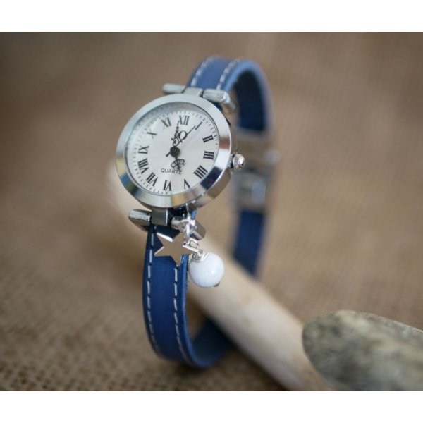 Watch with blue leather strap and white stitching