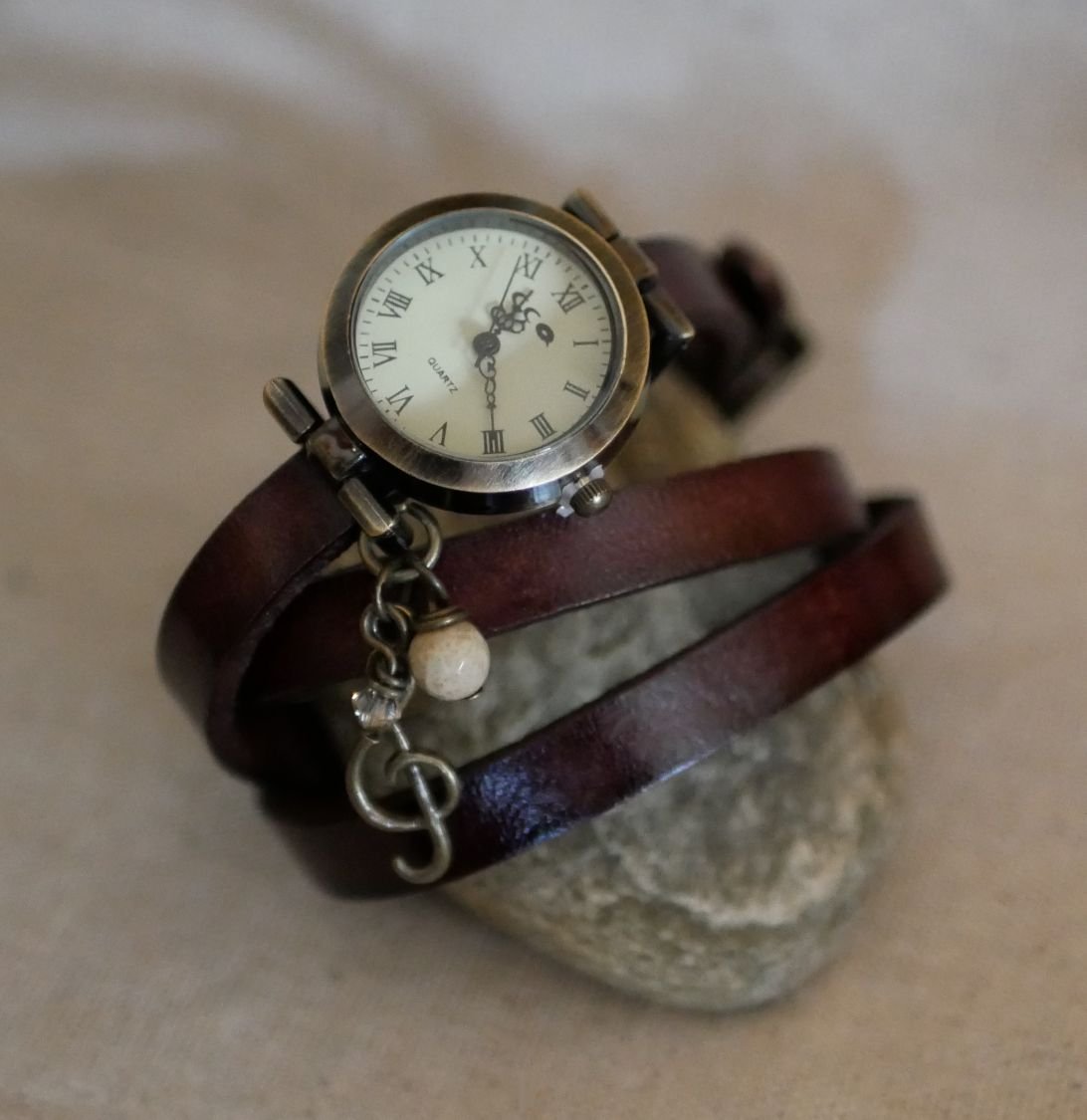 Leather bracelet watch with feather and pearl charms