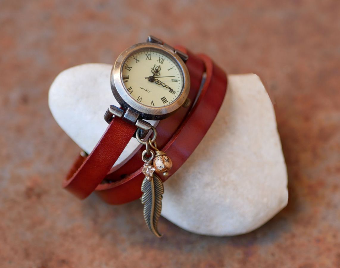 Leather bracelet watch with feather and pearl charms