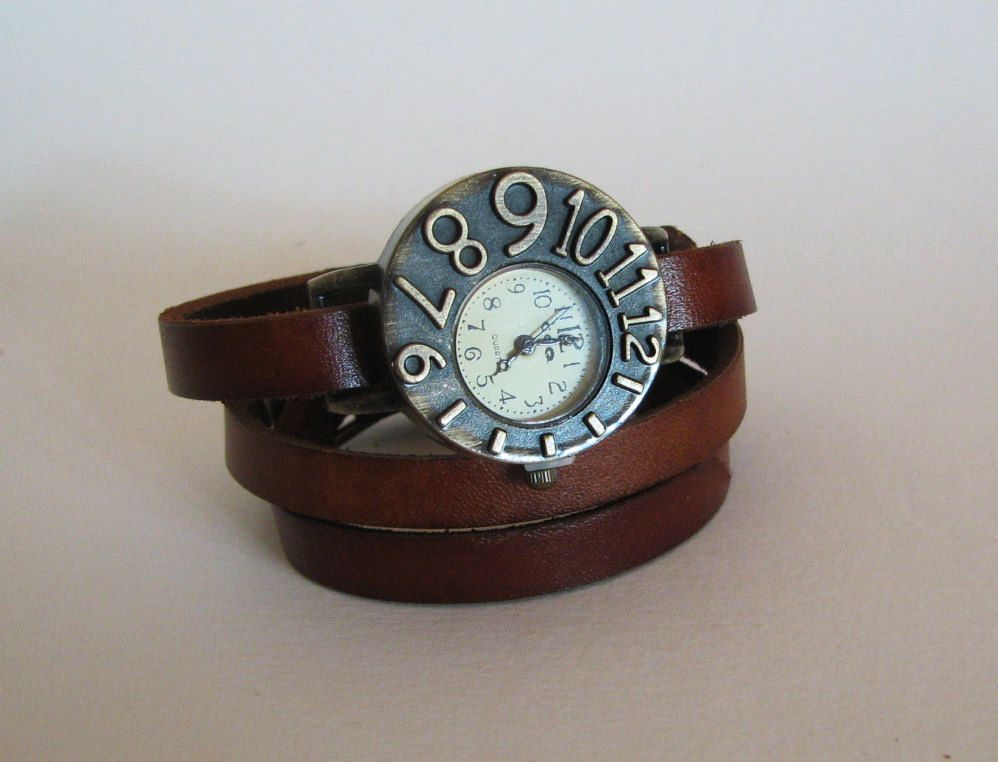 Watch with leather strap and asymmetrical dial