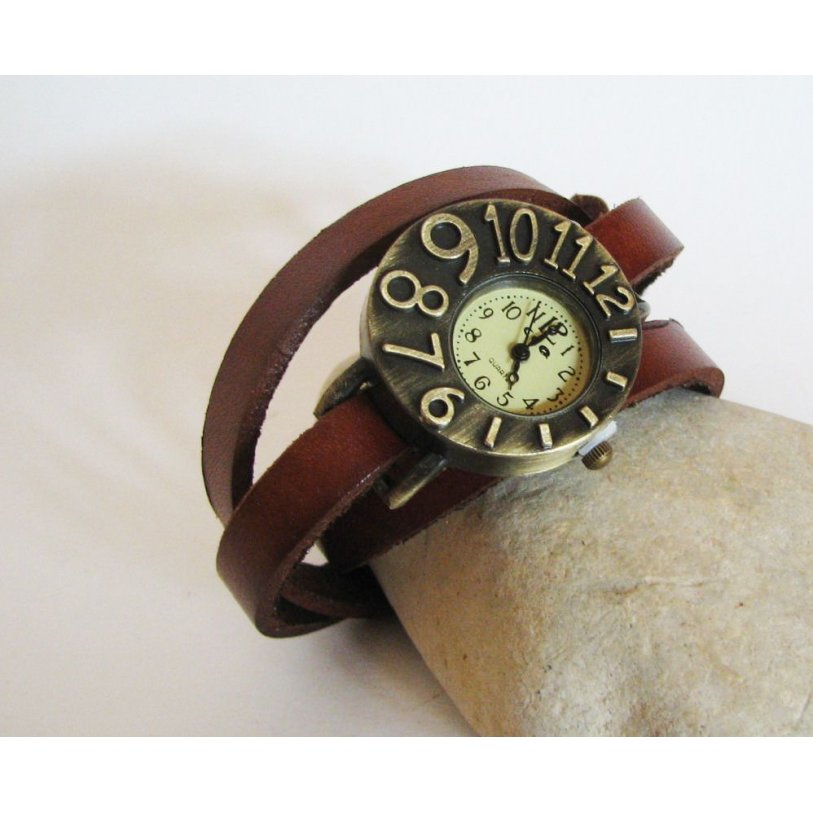 Watch with leather strap and asymmetrical dial