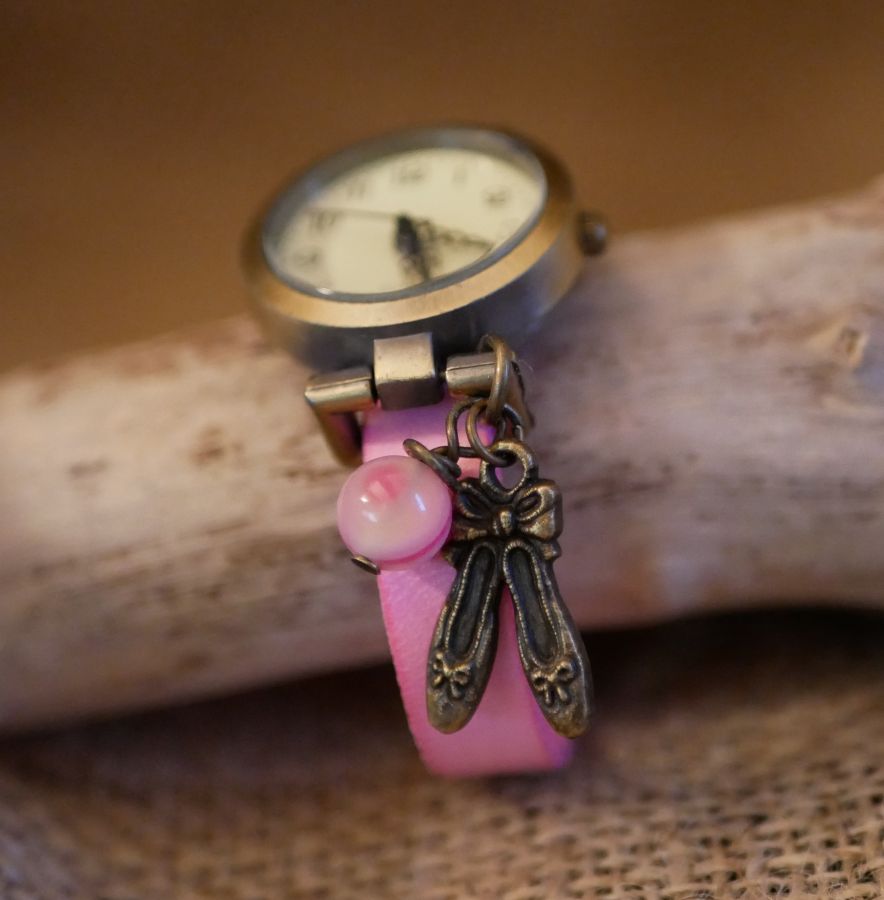 Pink leather girl's watch with adjustable bracelet charm