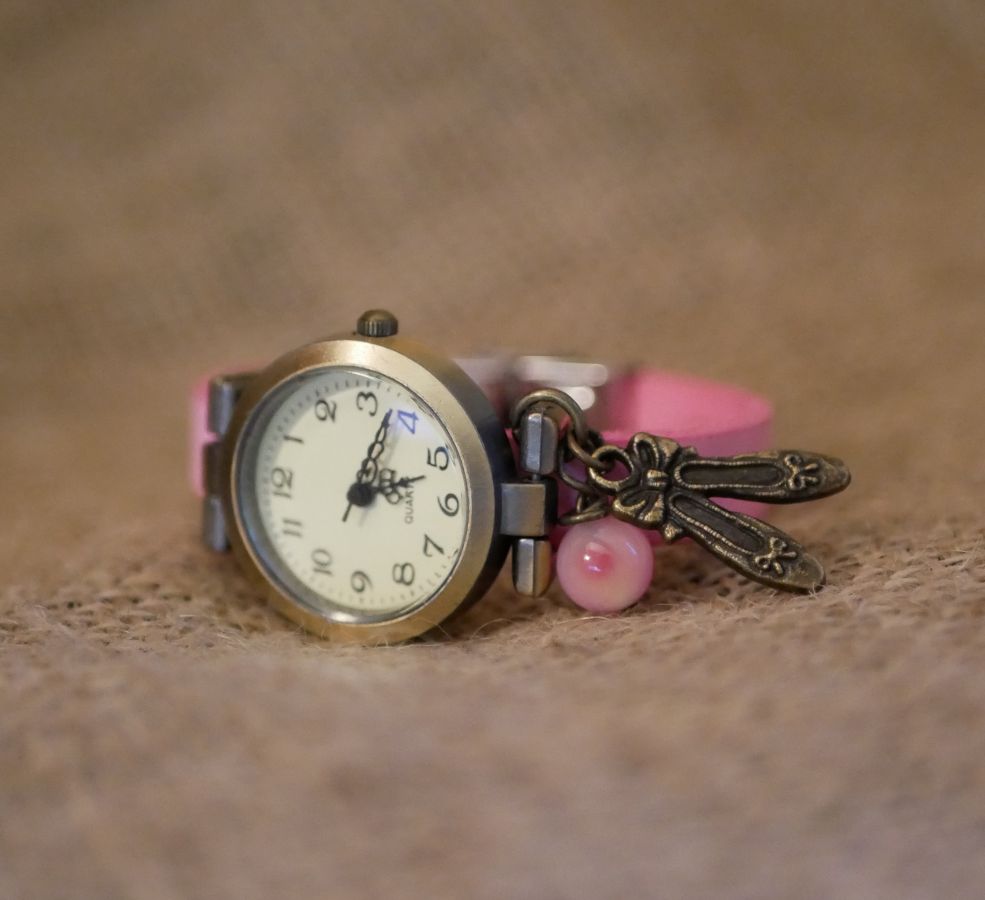 Pink leather girl's watch with adjustable bracelet charm
