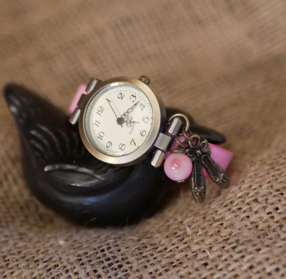 Pink leather girl's watch with adjustable bracelet charm
