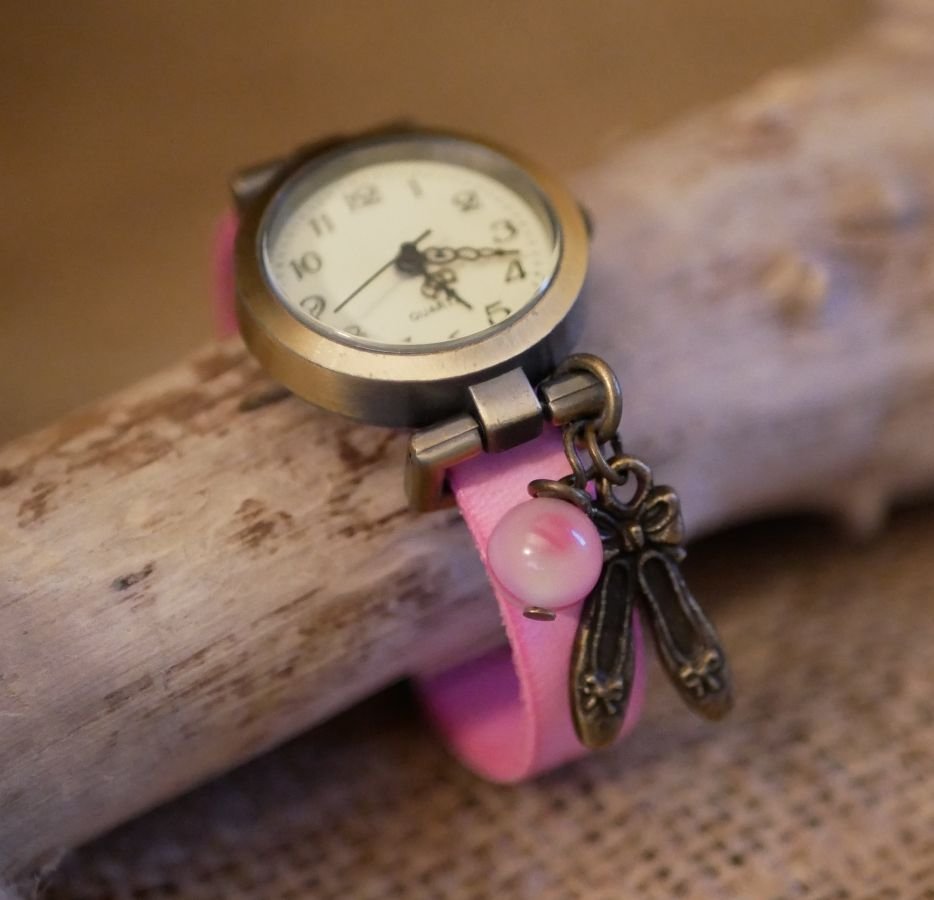 Pink leather girl's watch with adjustable bracelet charm