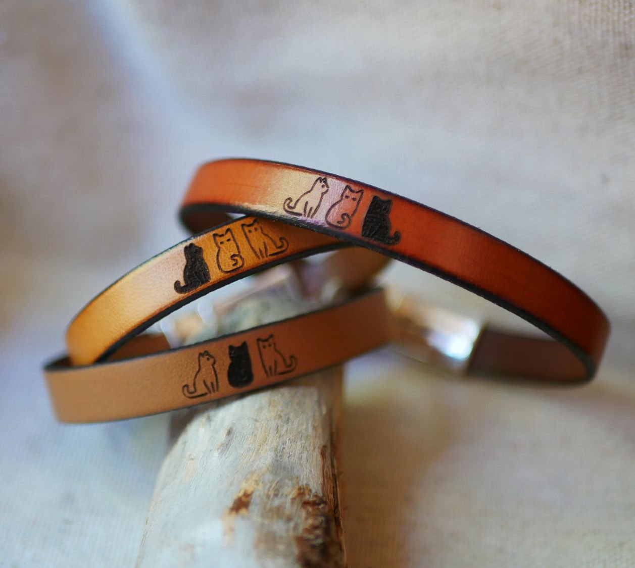 Trio of leather bracelets personalized by engraving with designs of your choice