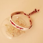 Florâme bracelet with red Misti liberty ribbon on white leather
