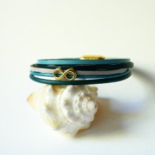 Multi-link bracelet in blue-tone leather with gold infinity motif